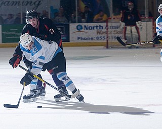 Scott R. Galvin | The Vindicator.Youngstown Phantoms forward Tommy Apap (21) battles with Lincoln Stars forward Brandon Schultz (21) for the puck during the first period at the Covelli Centre on April 1, 2017...