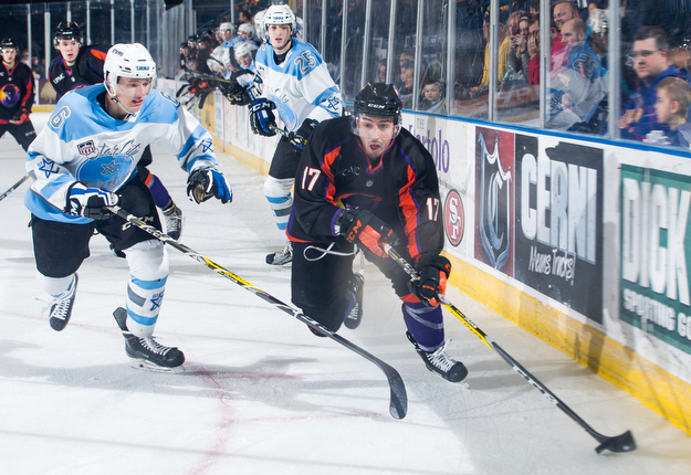 Scott R. Galvin | The Vindicator.Youngstown Phantoms forward Sam Craggs (17) skates the puck away form Lincoln Stars defenseman Luke Jaycox (6) during the first period  at the Covelli Centre on April 1, 2017..