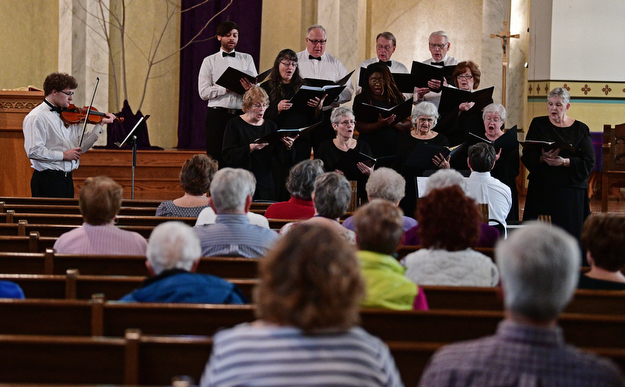 YOUNGSTOWN, OHIO - APRIL 2, 2017: Members of the Mahoning Valley Chorale Lenten Concert perform in front of the crowd at St. Angela Merici Parish, Sunday afternoon. DAVID DERMER | THE VINDICATOR