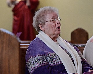YOUNGSTOWN, OHIO - APRIL 2, 2017: Sister Marguerite Holz H.M. of Villa Villa Miria, Pennsylvania sings along to "On Eagles Wings" during a performance by the Mahoning Valley Chorale Lenten Concert at St. Angela Merici Parish, Sunday afternoon. DAVID DERMER | THE VINDICATOR