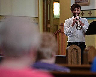 YOUNGSTOWN, OHIO - APRIL 2, 2017: Antoine Jackson of Warren plays the trumpet during a performance by the Mahoning Valley Chorale Lenten Concert at St. Angela Merici Parish, Sunday afternoon. DAVID DERMER | THE VINDICATOR