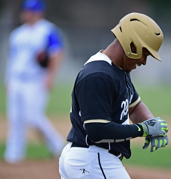 POLAND, OHIO - APRIL 3, 2017: Grant Williams #1 of Harding smiles after hitting a solo home run off starting pitcher Dan Drummond #2 of Poland in the second inning of Monday nights game at Poland High School. DAVID DERMER | THE VINDICATOR