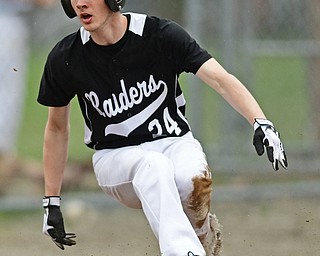 POLAND, OHIO - APRIL 3, 2017: Base runner Nick Fitzgerald #24 of Harding slides across home plate to score a run on a sacrifice fly by Grant Williams #1 in the third inning of Monday nights game at Poland High School. DAVID DERMER | THE VINDICATOR