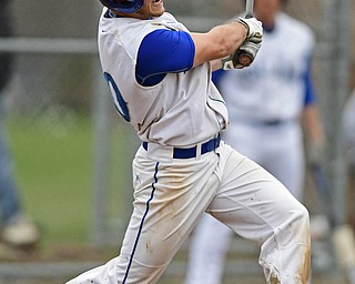 POLAND, OHIO - APRIL 3, 2017: Tony Chiaro #20 of Poland drives a bad to the outfield for a sacrifice fly in the fourth inning of Monday nights game at Poland High School. DAVID DERMER | THE VINDICATOR
