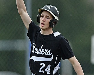POLAND, OHIO - APRIL 3, 2017: Nick Fitzgerald #24 of Harding celebrates after scoring a run on a RBI by Devon Chambers #2 in the sixth inning of Monday nights game at Poland High School. DAVID DERMER | THE VINDICATOR