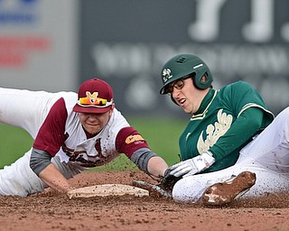 STRUTHERS, OHIO - APRIL 4, 2017: Second basemen Gino Guerrieri #4 of Mooney dives to tag out baserunner Dan Leslie #52 of Ursuline after he attempted to stretch a single into a double in the third inning of Tuesday nights game at Cene Park. Mooney won 10-6. DAVID DERMER | THE VINDICATOR