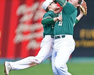 STRUTHERS, OHIO - APRIL 4, 2017: Right fielder Andrew Sabella #22 of Ursuline and second basemen Colin Balas #4 collide while Sabella holds onto the ball in the fifth inning of Tuesday nights game at Cene Park. Mooney won 10-6. DAVID DERMER | THE VINDICATOR