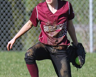 William D. Lewis the vindicator Boardman's Vanessa Roush (28) comes up covered in mud after making a diving catch during a 4-5-17 game with Howland at Boardman.
