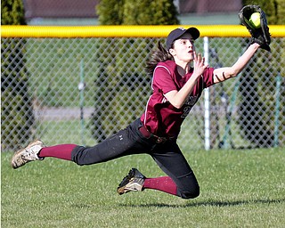 William D. Lewis the vindicator Boardman's Vanessa Roush (28) makes a diving catch during a 4-5-17 game with Howland at Boardman.