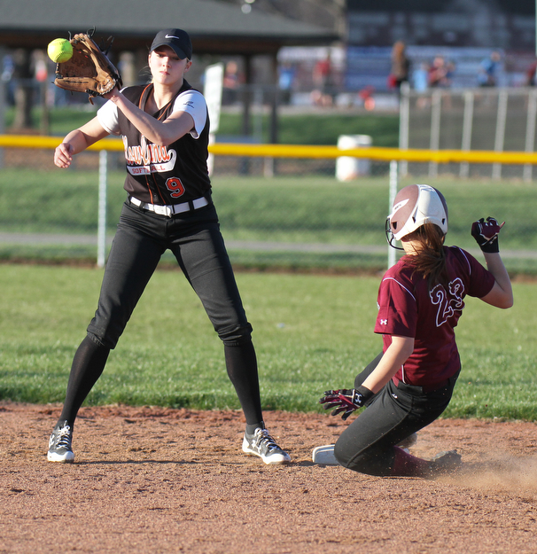 William D. Lewis the vindicator Boardman's Brooke Hoffman(23) i safe at 2nd as Howland's Sara Price(9) waits for the throw during a 4-5-17 game with  at Boardman.