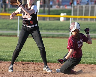 William D. Lewis the vindicator Boardman's Brooke Hoffman(23) i safe at 2nd as Howland's Sara Price(9) waits for the throw during a 4-5-17 game with  at Boardman.