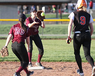 William D. Lewis the vindicator Howland's Sara Price(9) is out at 2nd as Boardman's Lauren Pavlansky(26) tosses the ball to Alicia Saxton(10) to make the play during a 4-5-17 game at Boardman.