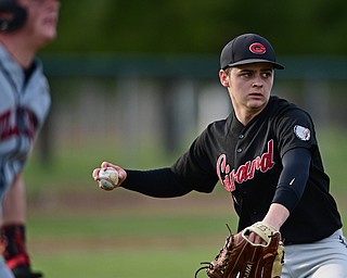 STRUTHERS, OHIO - MARCH 27, 2017: Pitcher Brady Hunkus #9 of Girard throws to first for the force out after a sacrifice bunt by Jake Rudzik #4 of Struthers in the third inning of Monday nights game at Cene Park. DAVID DERMER | THE VINDICATOR