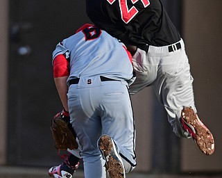 STRUTHERS, OHIO - MARCH 27, 2017: Relief pitcher Anthony Monaco #6 of Struthers collides with Shawn Leasure #24 of Girard while attempting to play a ball near the foul line in the fourth inning of Monday nights game at Cene Park. DAVID DERMER | THE VINDICATOR