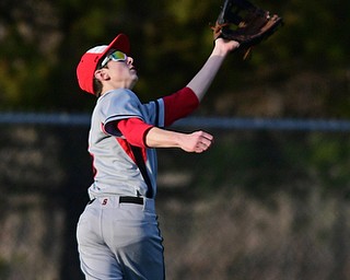 STRUTHERS, OHIO - MARCH 27, 2017: Left fielder Jared Laczko #5 of Struthers gets under the fly ball for the out in the fifth inning of Monday nights game at Cene Park. DAVID DERMER | THE VINDICATOR