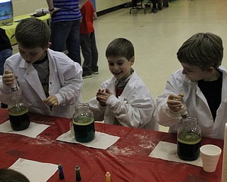 Neighbors | Abby Slanker.Hilltop Elementary School first-grade students experimented with salt volcanoes at a science station during the school’s annual STEM Week on March 7.