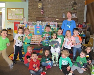 Neighbors | Alexis Bartolomucci.Abbey Loree and her class at Hitchcock Woods Early Learning Center dressed in green for their St. Patrick's Day celebration on March 16.