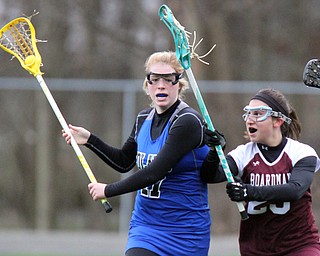 William d Lewis the vindicator Poland's Sydney Phillips(17) moves the ball around Boardman's Sarah Burkert(23)) during 4-6-17 action at Poland