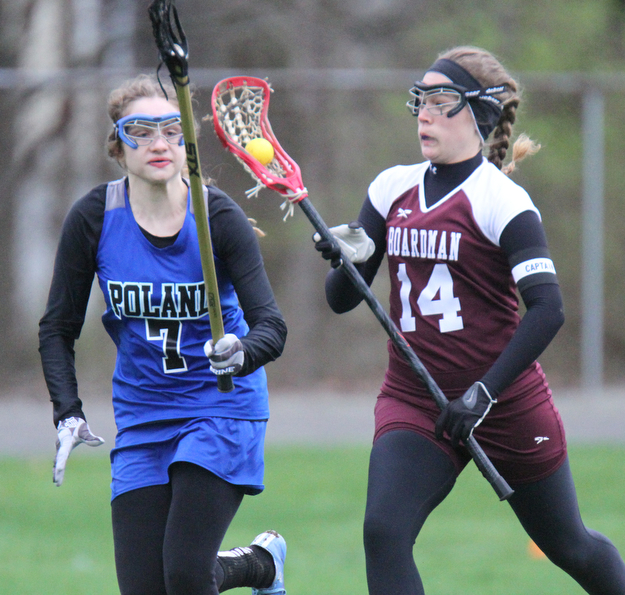 William d Lewis the vindicator  Boardman's Kate Bodamer(14) moves the ball around Poland's Sarah Leach(7) during 4-6-17 action at Poland.