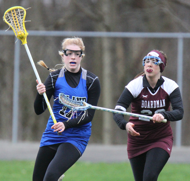 William d Lewis the vindicator Poland's Sydney Phillips(17) moves the ball around Boardman's Alexis Stutz(20)) during 4-6-17 action at Poland