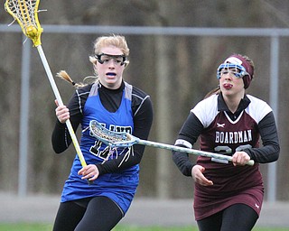 William d Lewis the vindicator Poland's Sydney Phillips(17) moves the ball around Boardman's Alexis Stutz(20)) during 4-6-17 action at Poland