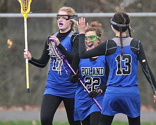 William d Lewis the vindicator Poland's Syndey Phillips(17),Marissa MAngino(22) and Galena Lopuchovsky(13) react after Phillips scored  during 4-6-17 action at Poland