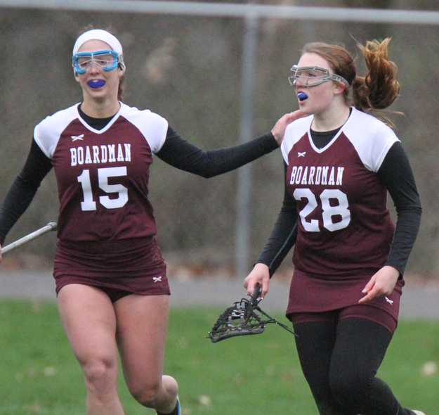 William d Lewis the vindicator Baordman's Alexis Phillips(28) gets congrats from Lindsay O'Nesti(15)  after scoring during 4-6-17 action at Poland