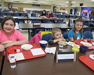 Neighbors | Alexis Bartolomucci.Children at the Austintown Souper Supper enjoyed their meal on March 15. Pictured are, from left, Raina, Alaura and Narana.