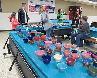 Neighbors | Alexis Bartolomucci.Guests at the Austintown Souper Supper at Fitch High School on March 16 looked at the different bowls that were made by Austintown students.
