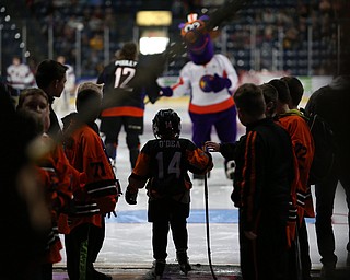 A young player waits to take the ice before the USA Hockey's National Team takes on the Youngstown Phantoms , Friday, April 7, 2017 at The Covelli Centre. ..(Nikos Frazier | The Vindicator)..