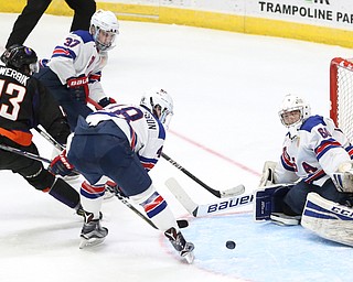 Phantoms forward Nicolas Werbik(13) assists defenseman Jake Gingell's(15) shot to get past Team USA goalie Anthony Yamnitsky(60) for a goal during the 2nd period as the USA Hockey's National Team takes on the Youngstown Phantoms, Saturday, April 8, 2017 at the Covelli Centre. The Phantoms won 3-0...(Nikos Frazier | The Vindicator)..
