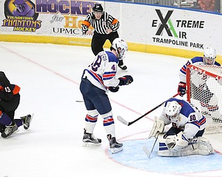 Phantoms forward Nicolas Werbik(13) assists defenseman Jake Gingell's(15) shot to get past Team USA goalie Anthony Yamnitsky(60) for a goal during the 2nd period as the USA Hockey's National Team takes on the Youngstown Phantoms, Saturday, April 8, 2017 at the Covelli Centre. The Phantoms won 3-0...(Nikos Frazier | The Vindicator)..