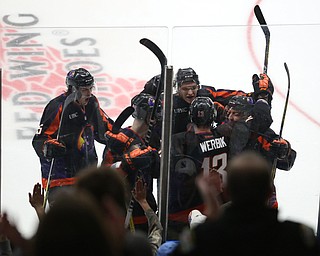 Phantoms players celebrate with forward Nicolas Werbik(13) after scoring a goal during the 3rd period as the USA Hockey's National Team takes on the Youngstown Phantoms, Saturday, April 8, 2017 at the Covelli Centre. The Phantoms won 3-0...(Nikos Frazier | The Vindicator)..