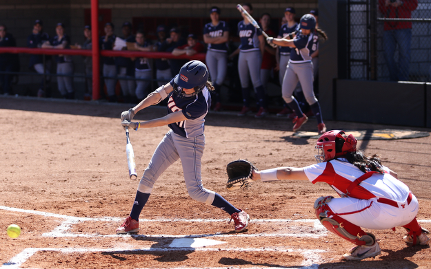 UIC first baseman Taylor Cairns(17) swings at during the 2nd inning as the the UIC Flames  take on the Youngstown Penguins, Saturday, April 8, 2017 at the YSU Softball Field. ..(Nikos Frazier | The Vindicator)..