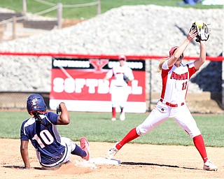 Youngstown State shortstop Tatum Christy(12) reaches up for the ball tagging out UIC infielder Tiana Mack-Miller(10) during the 3rd inning as the the UIC Flames  take on the Youngstown Penguins, Saturday, April 8, 2017 at the YSU Softball Field. ..(Nikos Frazier | The Vindicator)..