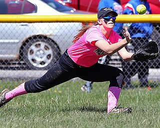 MICHAEL G TAYLOR | THE VINDICATOR- 04-08-17 -  Joanne Kernan Memorial (Irish Strikeout Cancer Softball Tournament) at Candlelite Knolls in Bazetta, OH., Champion Flashes vs West Branch Warriors. 2nd inning, West Branch's RF #24 Jenna Rockwell makes diving catch for the 3rd out.