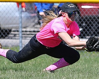 MICHAEL G TAYLOR | THE VINDICATOR- 04-08-17 -  Joanne Kernan Memorial (Irish Strikeout Cancer Softball Tournament) at Candlelite Knolls in Bazetta, OH., Champion Flashes vs West Branch Warriors. 2nd inning, West Branch's RF #24 Jenna Rockwell makes diving catch for the 3rd out.