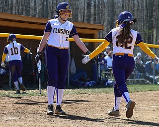 MICHAEL G TAYLOR | THE VINDICATOR- 04-08-17 -  Joanne Kernan Memorial (Irish Strikeout Cancer Softball Tournament) at Candlelite Knolls in Bazetta, OH., Champion Flashes vs West Branch Warriors. 5th inning, Champion's #6 Allison Smith congratulates her teammate #22 Carli Swipas after Carli knocked in Champion's 2nd run