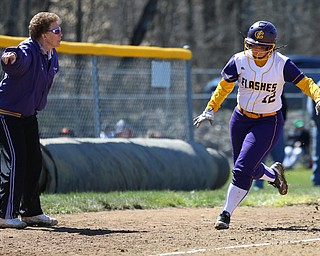 MICHAEL G TAYLOR | THE VINDICATOR- 04-08-17 -  Joanne Kernan Memorial (Irish Strikeout Cancer Softball Tournament) at Candlelite Knolls in Bazetta, OH., Champion Flashes vs West Branch Warriors. 5th inning,Champion's head coach Cheryl Weaver sends home  Champion's #12 Gabby Hollenbaugh for Champion's 3rd run