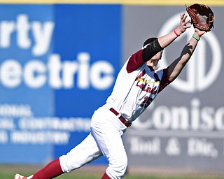 STRUTHERS, OHIO - APRIL 8, 2017: Cardinal Mooney's Ryan Stafanec (15) stretches in an unsuccessful attempt to catch the ball allowing two runs to score in the fourth inning of Saturday afternoons game at Cene Park. St. Ed's won 4-1. DAVID DERMER | THE VINDICATOR