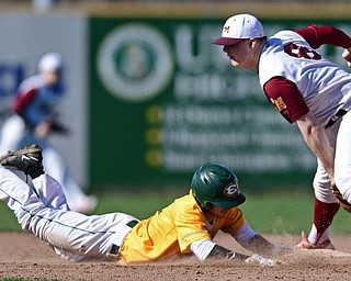 John Sherman STRUTHERS, OHIO - APRIL 8, 2017: St. Edward's John Sherman (9) dives into second to avoid the pickoff tag from Cardinal Mooney's Bryce Richey (8) in the sixth inning of Saturday afternoons game at Cene Park. St. Ed's won 4-1. DAVID DERMER | THE VINDICATOR