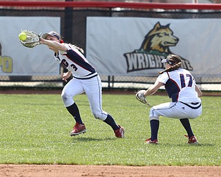 UIC senior outfielder Savannah Soppet(3) goes for a catch as UIC junior infielder Taylor Cairns(17) ducks out of the way during the 1st inning as the UIC Flames take on the Youngstown State Penguins, Sunday, April 9, 2017 at the YSU Softball Field. The Flames won 2-1...(Nikos Frazier | The Vindicator)..