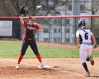 Youngstown State junior first baseman Kelly Thompson-Cappadocio(7) reaches high for the catch as UIC freshman infielder Kayla Wedl(6) runs towards first during the 3rd inning as the UIC Flames take on the Youngstown State Penguins, Sunday, April 9, 2017 at the YSU Softball Field. The Flames won 2-1...(Nikos Frazier | The Vindicator)..