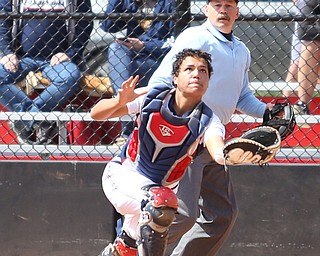 UIC sophomore catcher Jasmine Willis(14) runs for the ball during the 4th inning as the UIC Flames take on the Youngstown State Penguins, Sunday, April 9, 2017 at the YSU Softball Field. The Flames won 2-1...(Nikos Frazier | The Vindicator)..