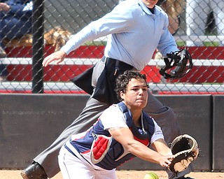UIC sophomore catcher Jasmine Willis(14) runs for the ball during the 4th inning as the UIC Flames take on the Youngstown State Penguins, Sunday, April 9, 2017 at the YSU Softball Field. The Flames won 2-1...(Nikos Frazier | The Vindicator)..
