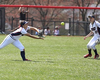 UIC sophomore outfielder Lexi Watts(1) dives for the ball as UIC junior infielder Taylor Cairns(17) watches during the 5th inning as the UIC Flames take on the Youngstown State Penguins, Sunday, April 9, 2017 at the YSU Softball Field. The Flames won 2-1...(Nikos Frazier | The Vindicator)..