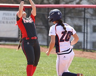 Youngstown State junior first baseman Kelly Thompson-Cappadocio(7) gets the out as UIC freshman outfielder Jennah Speth(20) tags onto first during the 6th inning as the UIC Flames take on the Youngstown State Penguins, Sunday, April 9, 2017 at the YSU Softball Field. The Flames won 2-1...(Nikos Frazier | The Vindicator)..