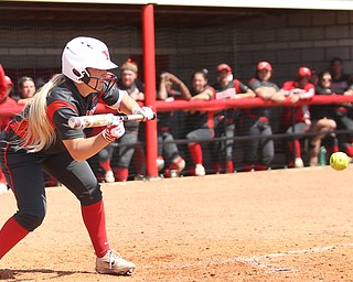 Youngstown State senior outfielder Sarah Dowd(14) leans down for the bunt during the 6th inning as the UIC Flames take on the Youngstown State Penguins, Sunday, April 9, 2017 at the YSU Softball Field. The Flames won 2-1...(Nikos Frazier | The Vindicator)..