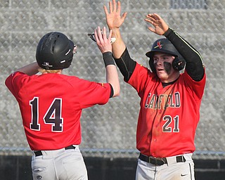 William D. Lewis The Vindicator  Canfield's Richei Juliano(14) Mark Whitman(210 react after scoring during 4-10-17 game with WGH at Canfield.