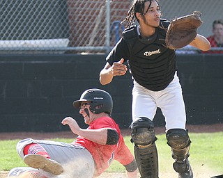 William D. Lewis The Vindicator  Canfield's  Anthony Longo(1) is safe after scoring during 4-10-17 game with WGH at Canfield. Waiting for the throw is WGH's Devin Chambers(10).